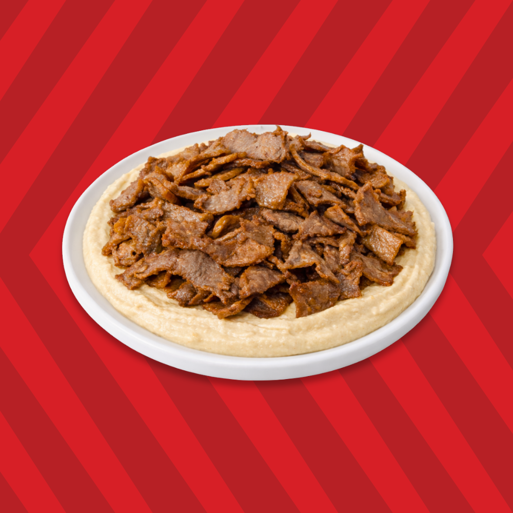 Hummus topped with donair meat slices